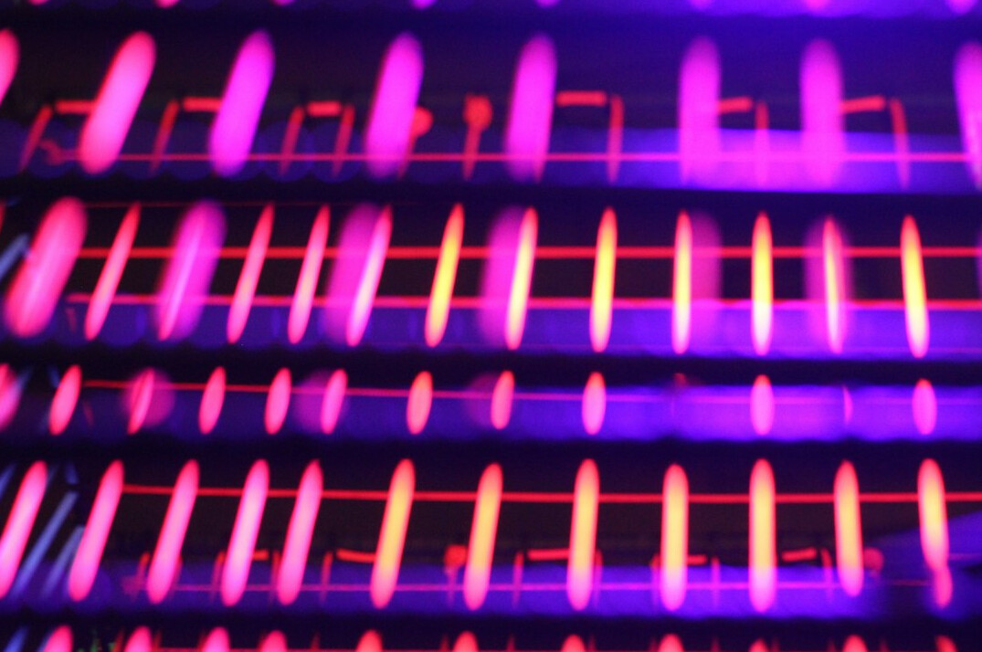Server racks with glowing signal routing equipment